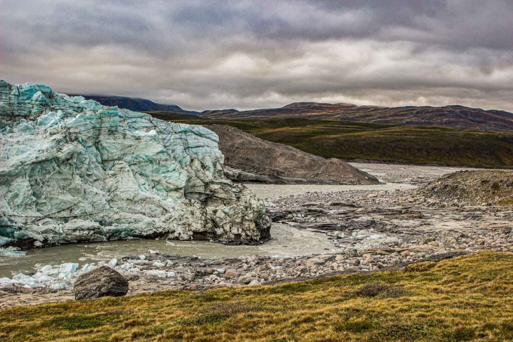 River flowing around the chunk of the Greenland ice-cap edge