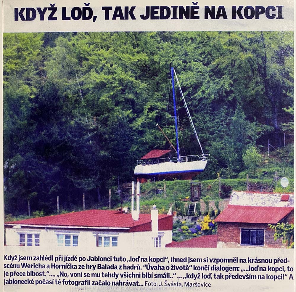 Newspaper article with boat on the hill