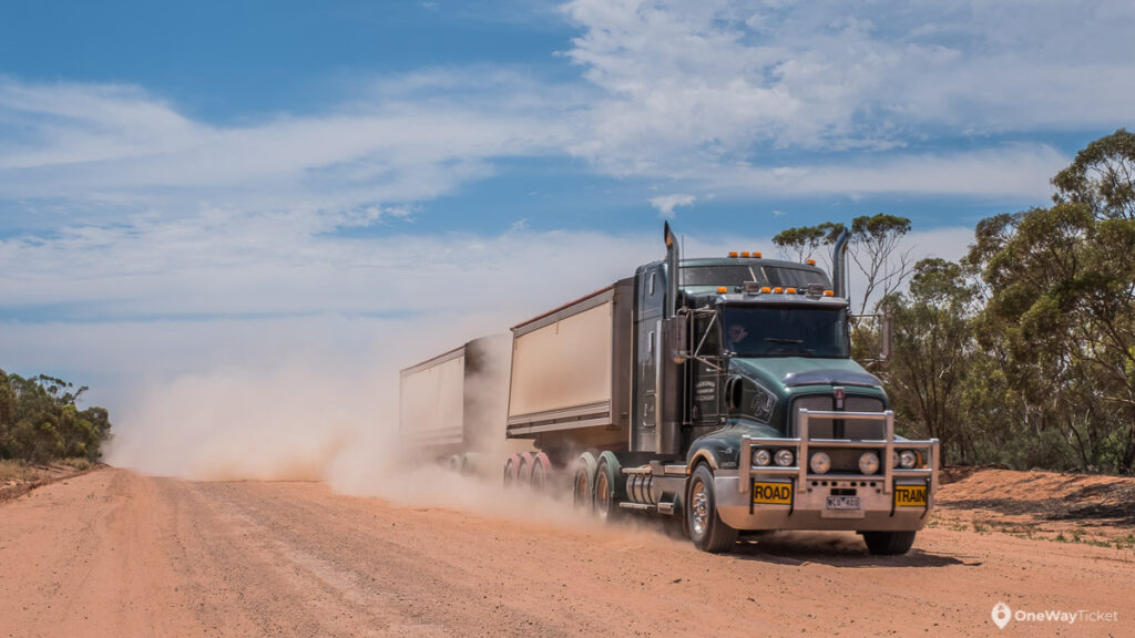 Long Australian roadtrain truck driving thru the australian outback