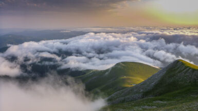 Sunset from the Pic d´Orhy. The green hills looking out of the clouds in the valley