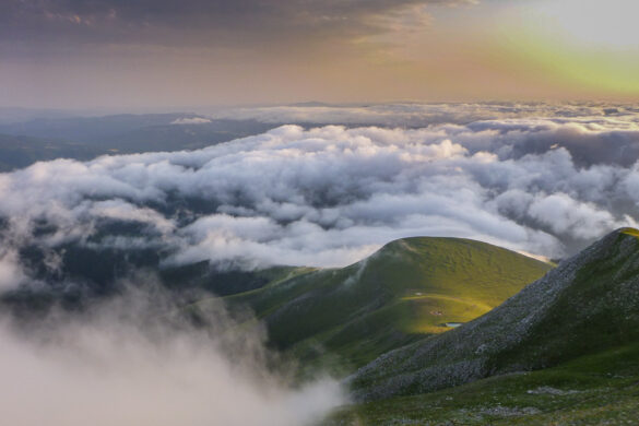 Sunset from the Pic d´Orhy. The green hills looking out of the clouds in the valley