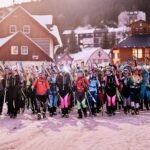 A lots of skimo racer in the starting line with skis on backpacks