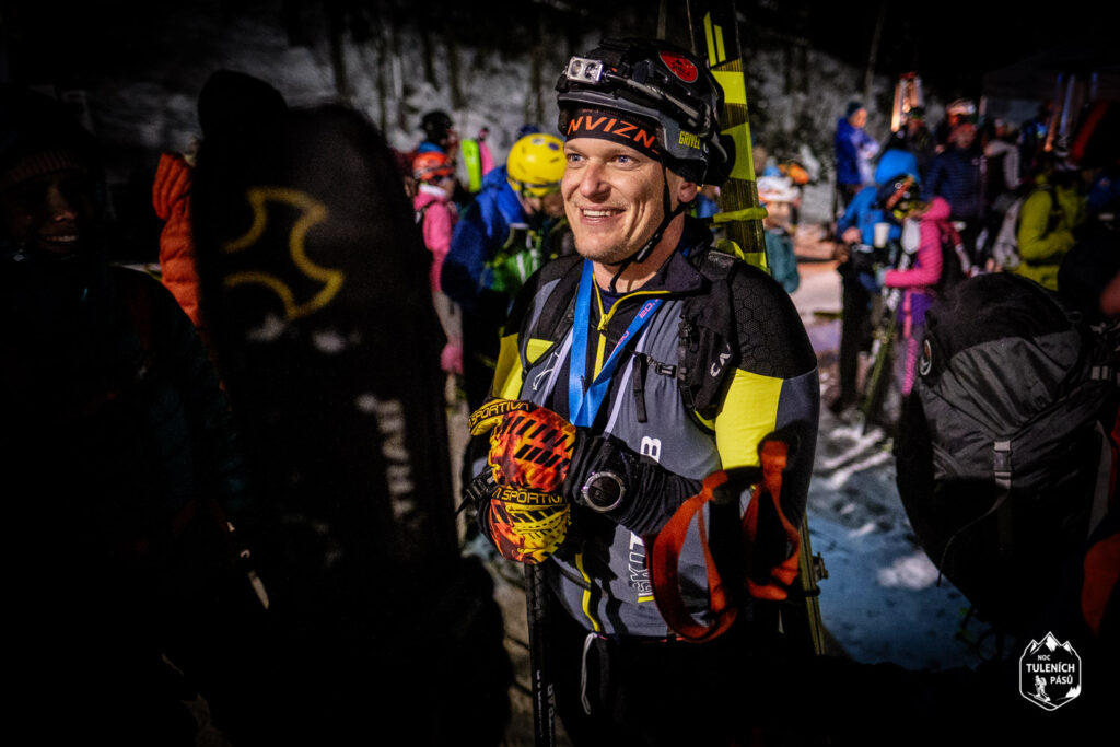 a guy in skimo suit preparing for the race